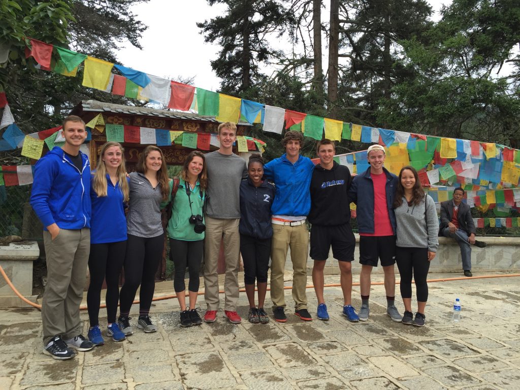 ACE in China students standing in front of prayer flags