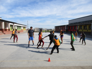 ACE Student-Athletes Play Soccer with Children