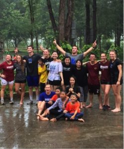 Coaches and Kids from Camp Playing in the Rain