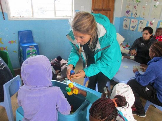 student teaching child in classroom