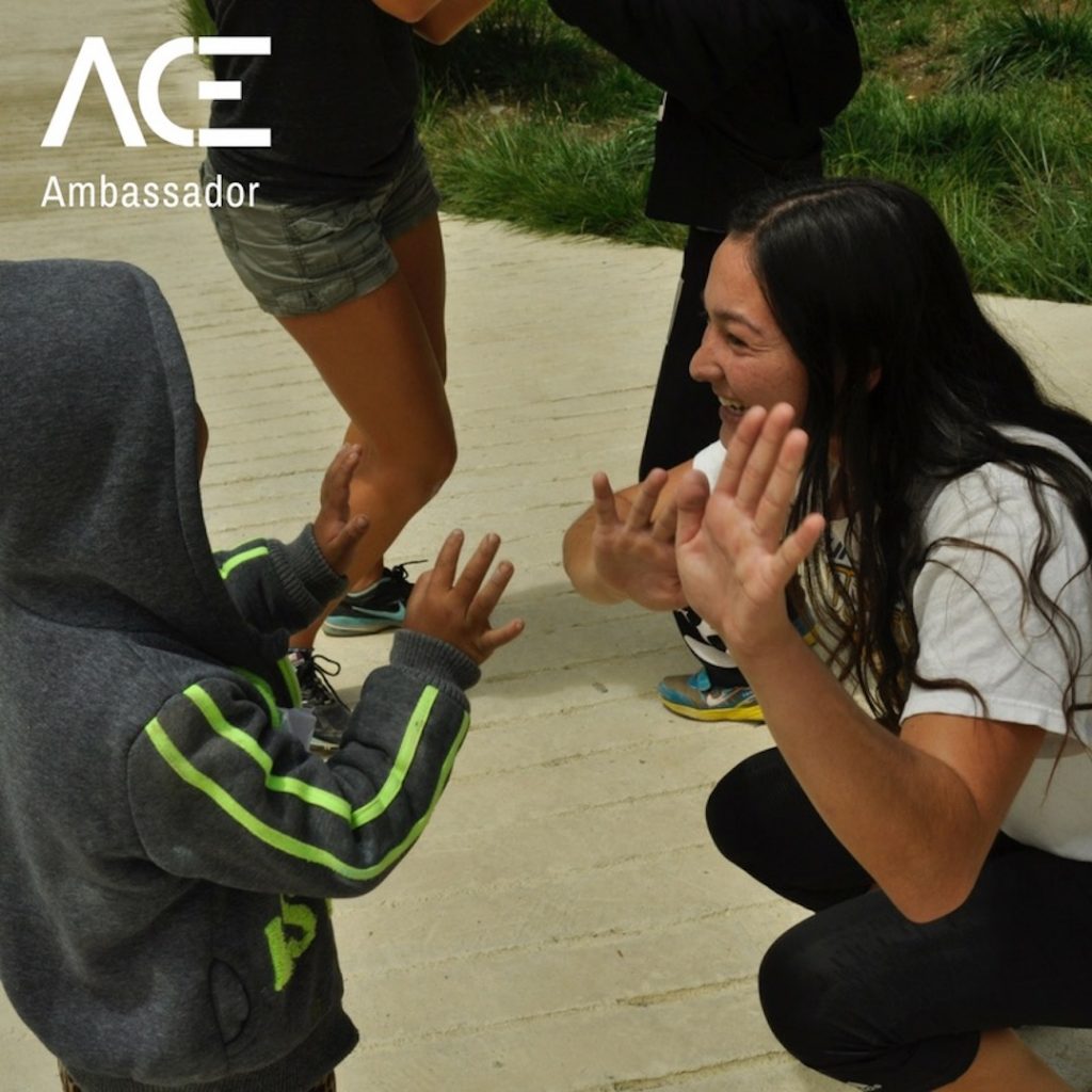 ACE participant high fives kids