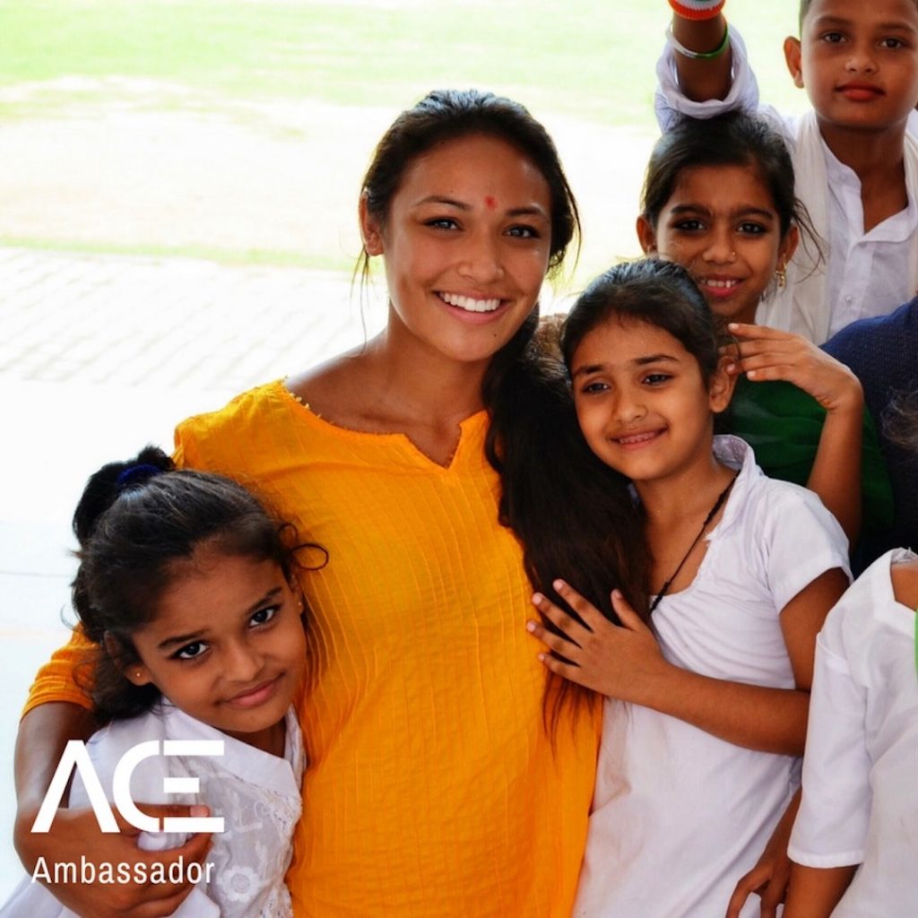 ACE participant posing with VIDYA school children