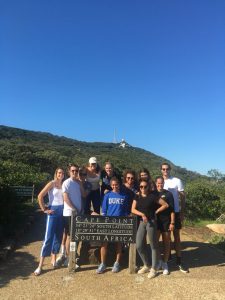 group shot of students by Cape Point sign