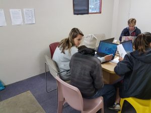 students learning computer skills together