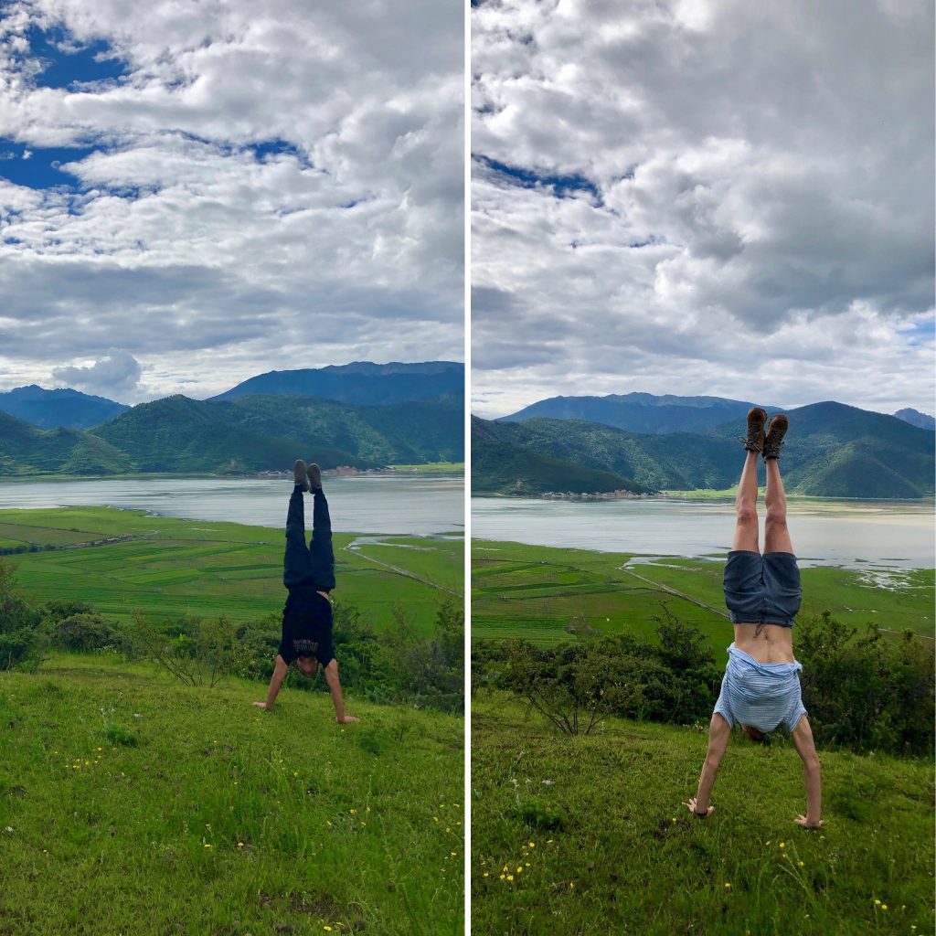 two students doing handstands