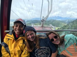 program director and two students in cable car