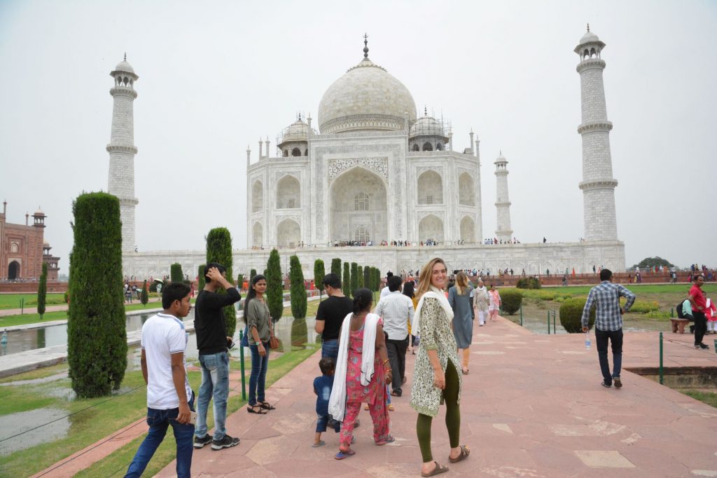 student in front of Taj Mahal