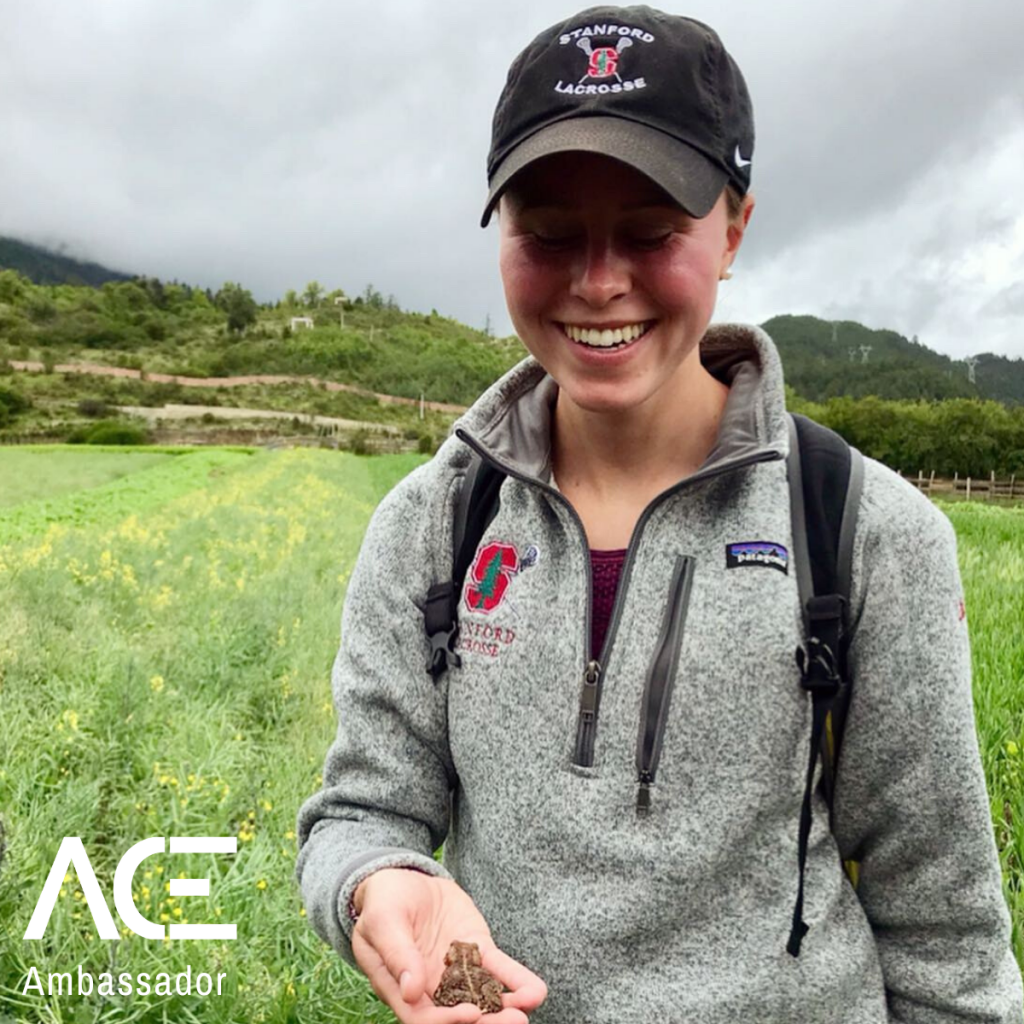 Woman holding a frog in her hand