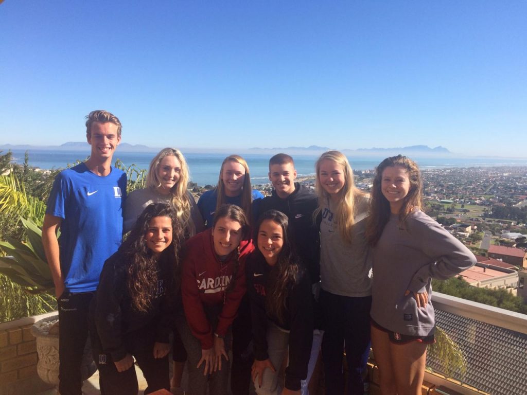 group of student-athletes by sea overlook