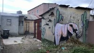 township home with painted art on home wall