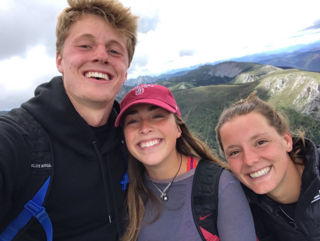 group selfie atop a mountain