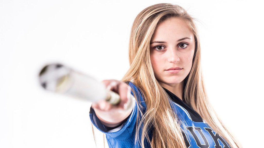 girl holidng a baseball bat