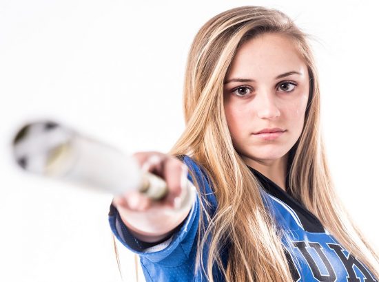 girl holidng a baseball bat
