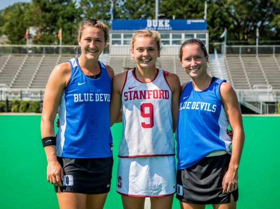 three field hockey players