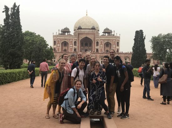 Group posing for photo in India