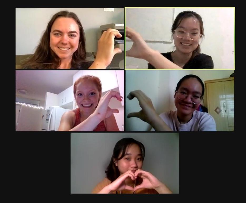 zoom screenshot of women making heart symbols with their hands