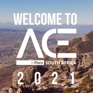 mountainous overlook behind welcome to ACE in Place South Africa welcome logo
