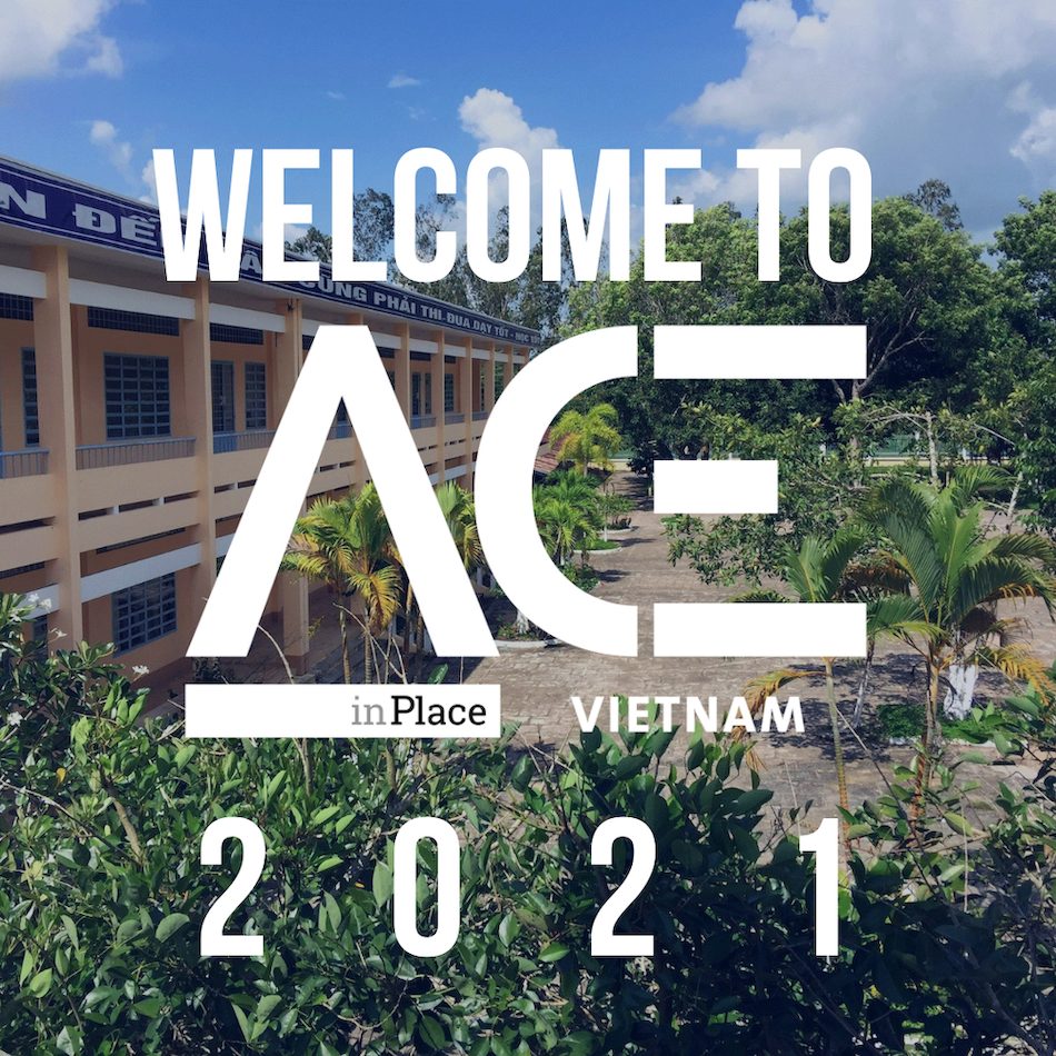 school building behind ACE in Place Vietnam welcome logo