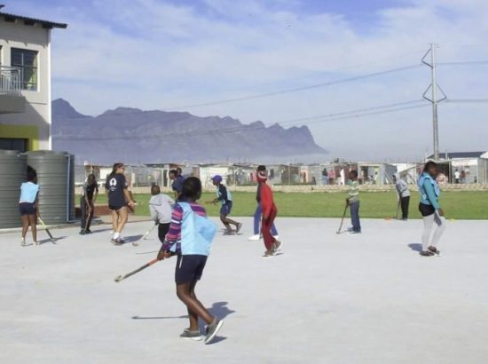students and teachers playing sports outside