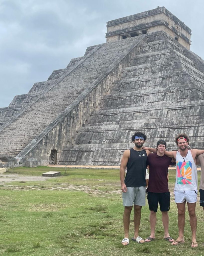 men standing in front of pyramid