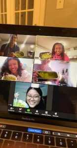 people holding up food on zoom group screenshot