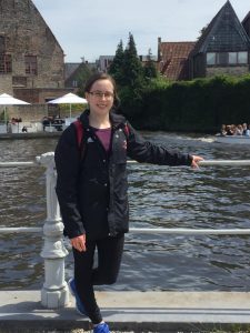 woman posing in front of river