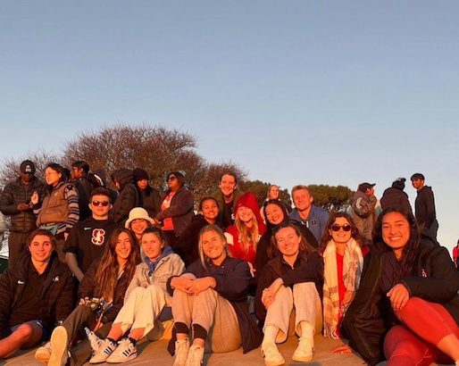 group photo in front of sunset