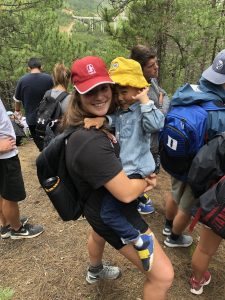 student with young boy in China