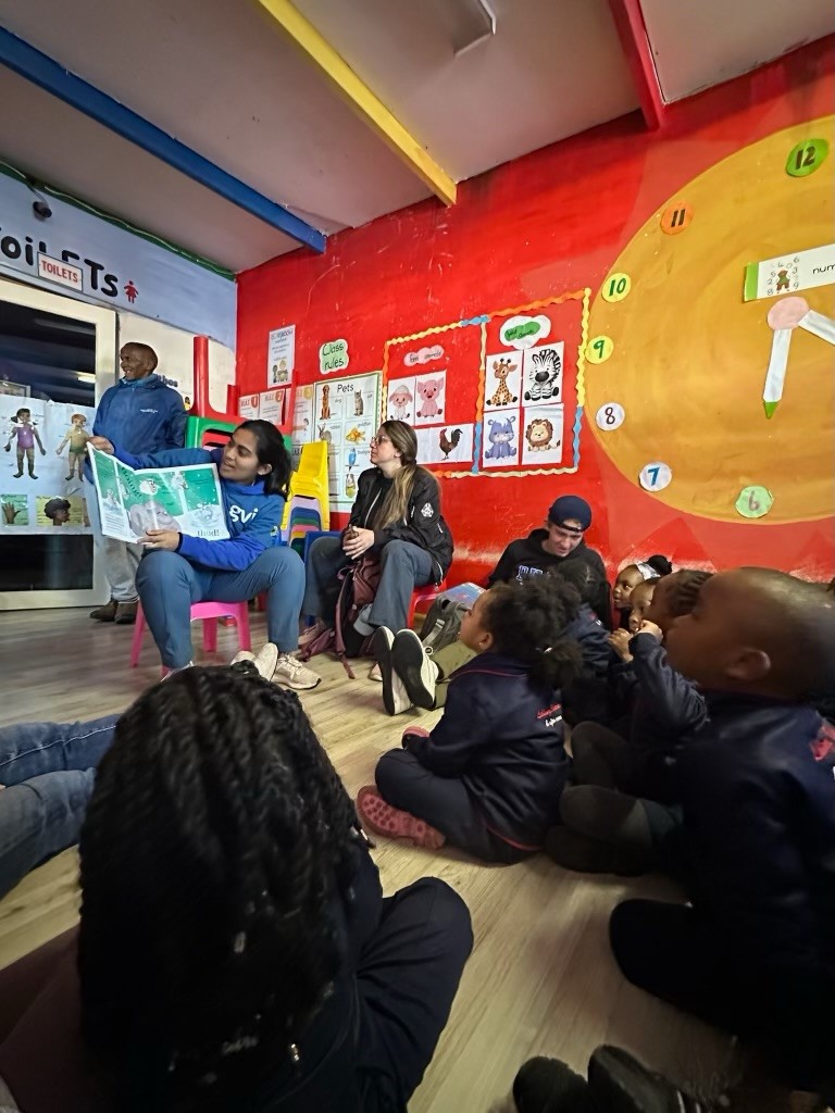 student reading to children