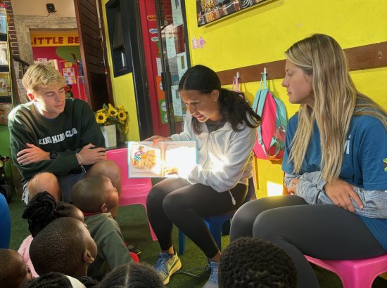 student reading to children