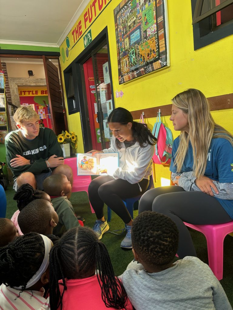 student reading to children