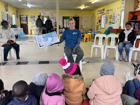 student reading to children