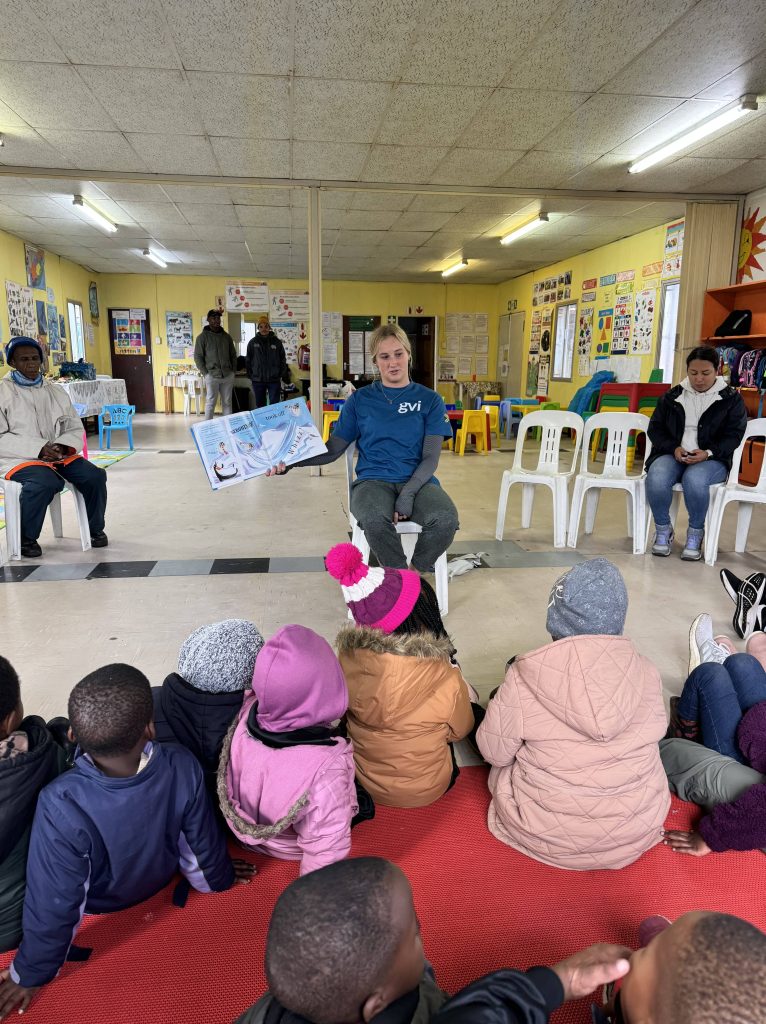 student reading to children