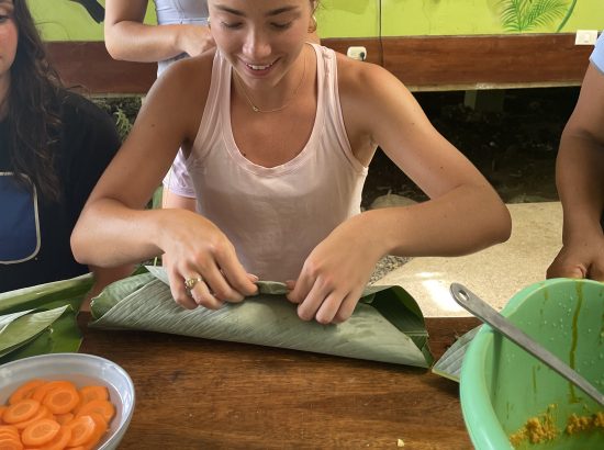 girl making tamales