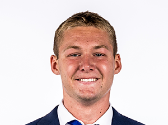 Headshot wearing nvay suit